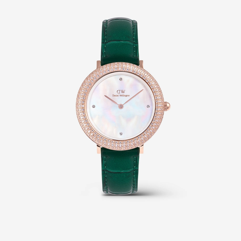 Watch with a crystal bezel, mother of pearl dial and a green leather strap