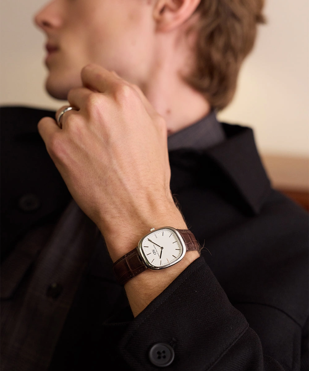 Editorial portrait with a watch and a ring in focus